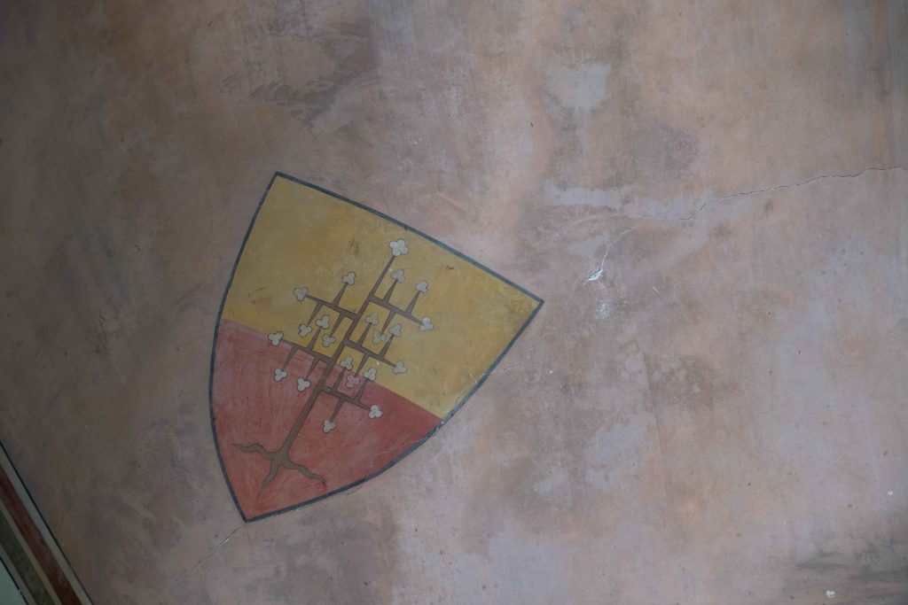 Stains of haunted images on the ceiling of an Italian medieval building